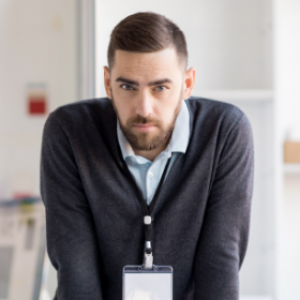serious-office-worker-looking-at-camera-86QF37A.png
